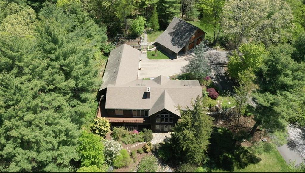 445 Conant Road Weston, MA 02493 - Photo 3 of 31 an aerial view of a house with outdoor space