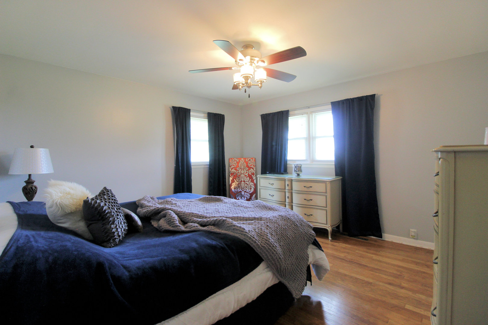 2838 River Road Kankakee, IL 60901 - Photo 13 of 24 a bedroom with a bed and a chandelier