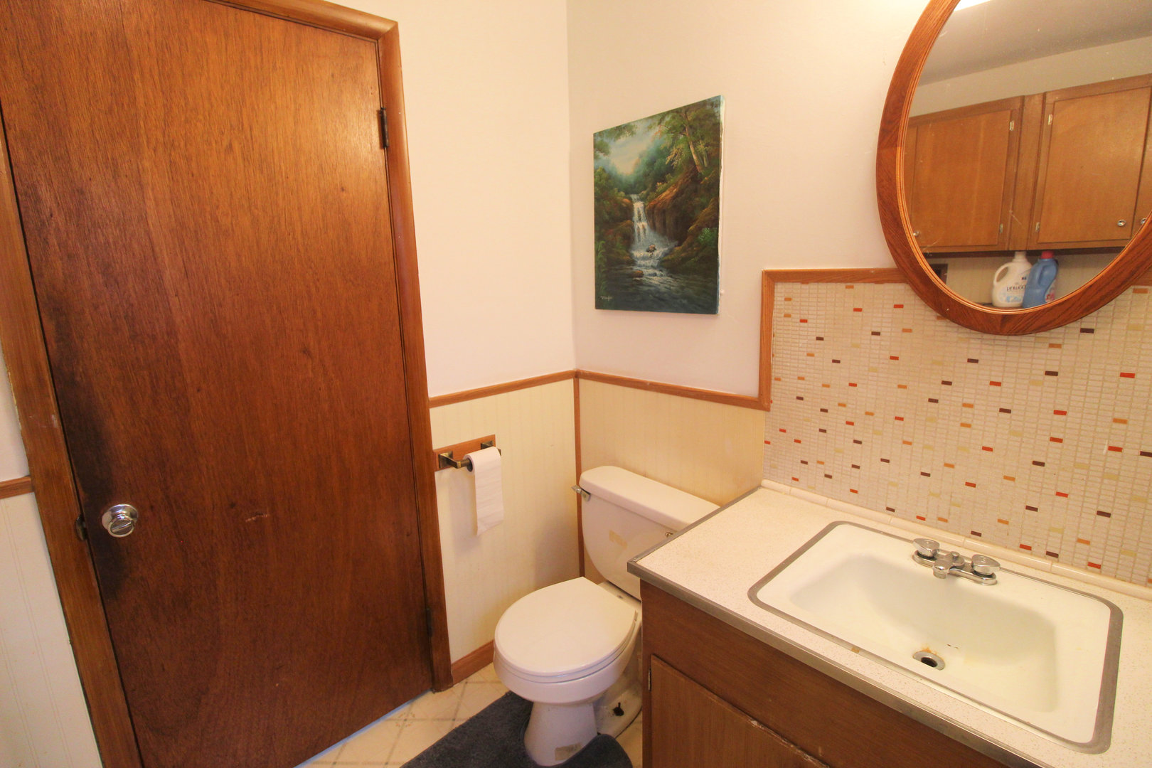2838 River Road Kankakee, IL 60901 - Photo 20 of 24 a bathroom with a sink toilet and a mirror