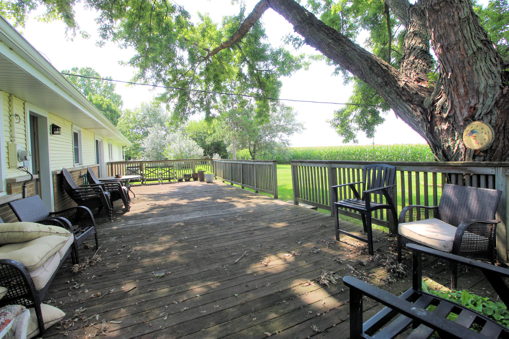 2838 River Road Kankakee, IL 60901 - Photo 21 of 24 a view of a deck with furniture and trees around