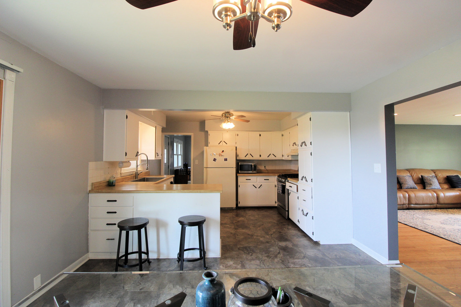 2838 River Road Kankakee, IL 60901 - Photo 7 of 24 a kitchen with stainless steel appliances kitchen island granite countertop a sink and cabinets