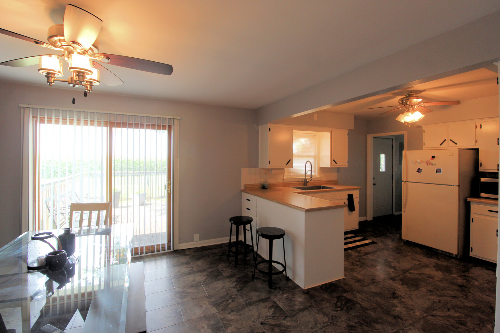 2838 River Road Kankakee, IL 60901 - Photo 9 of 24 a kitchen with a sink stove and refrigerator