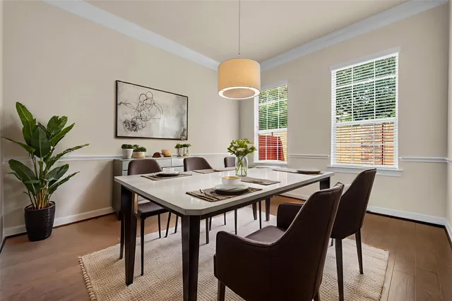 a view of a dining room with furniture window and wooden floor