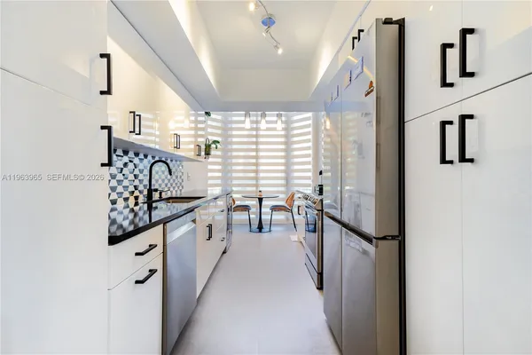 a view of a kitchen with windows