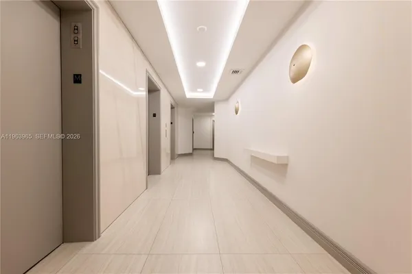 a view of a hallway with staircase