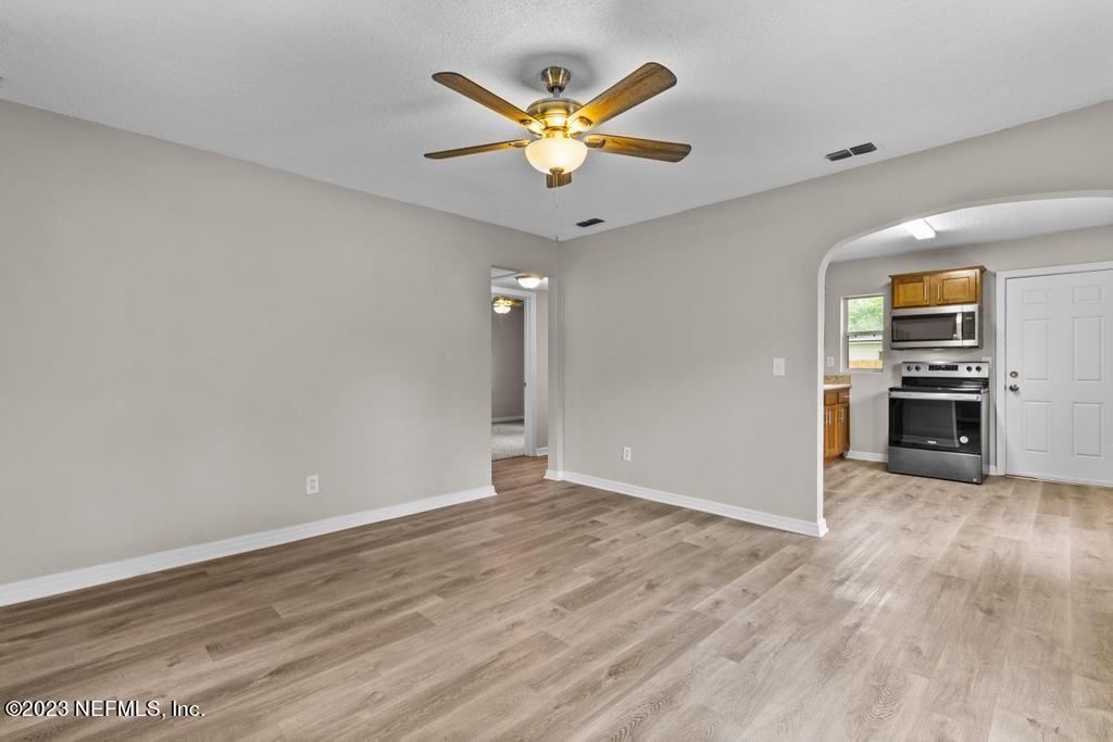 1023 Seba Street Jacksonville, FL 32205 - Photo 11 of 27 a view of an empty room with window and wooden floor