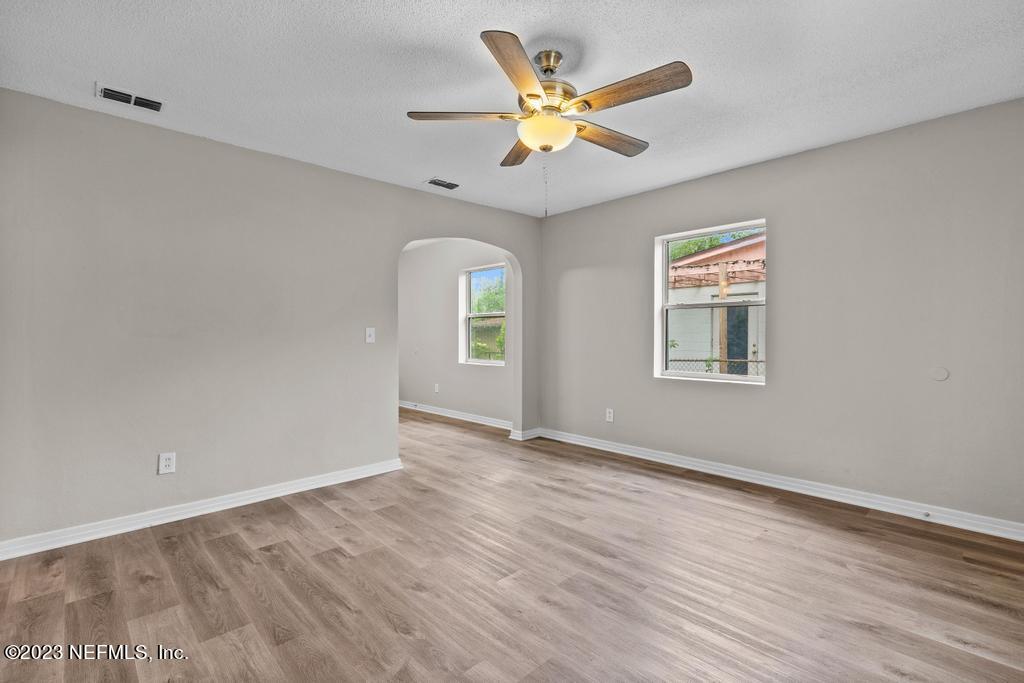 1023 Seba Street Jacksonville, FL 32205 - Photo 12 of 27 an empty room with window and ceiling fan