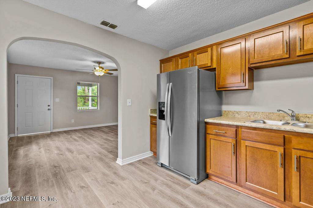 1023 Seba Street Jacksonville, FL 32205 - Photo 14 of 27 a kitchen with stainless steel appliances granite countertop a refrigerator and a stove