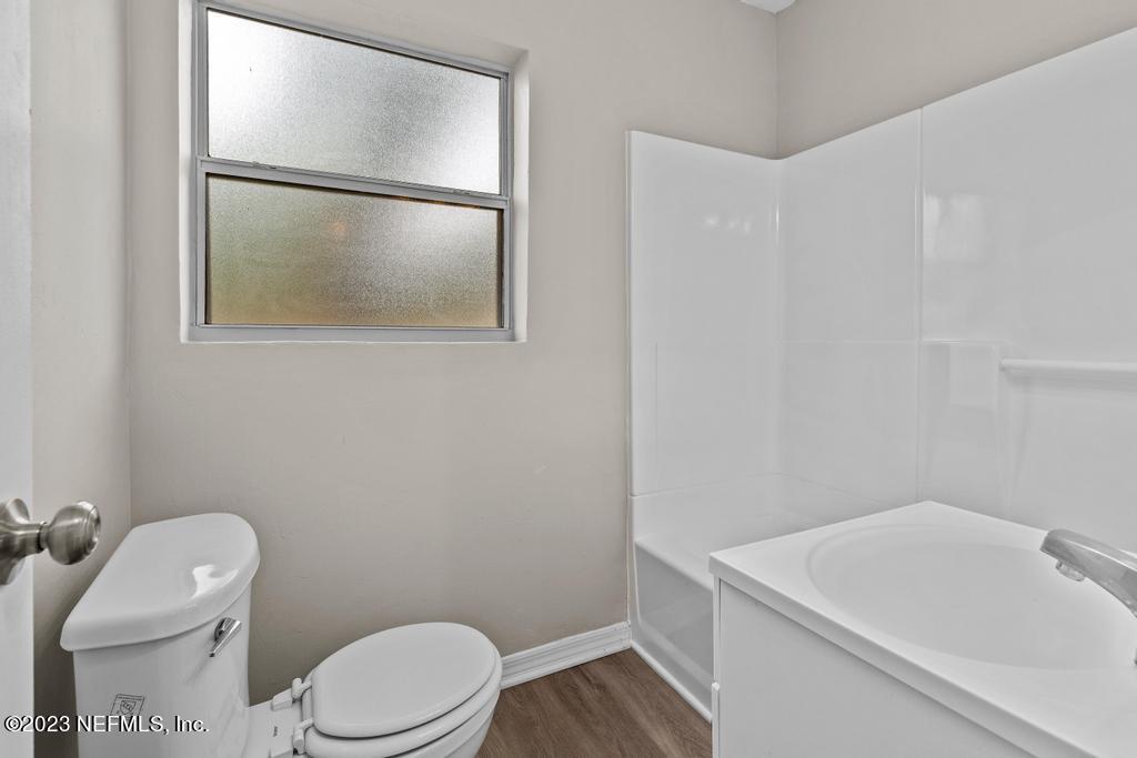 1023 Seba Street Jacksonville, FL 32205 - Photo 20 of 27 a white toilet sitting next to a bathroom sink
