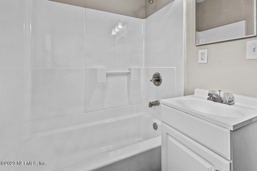 1023 Seba Street Jacksonville, FL 32205 - Photo 21 of 27 a bathroom with a sink a toilet and shower