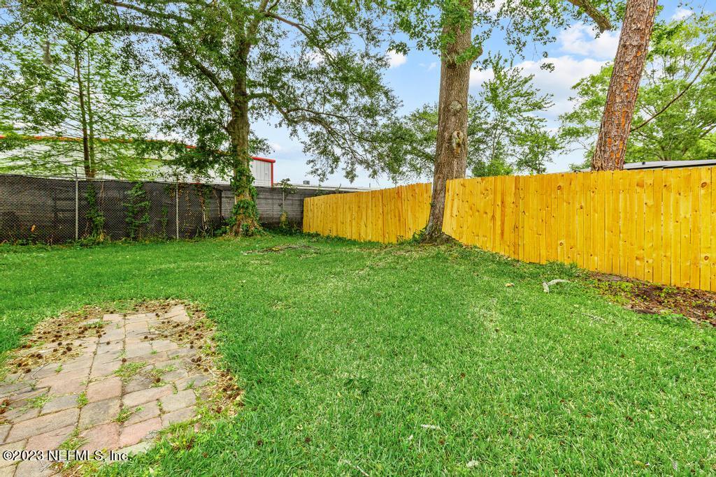 1023 Seba Street Jacksonville, FL 32205 - Photo 26 of 27 a view of yard with swimming pool and trees in the background