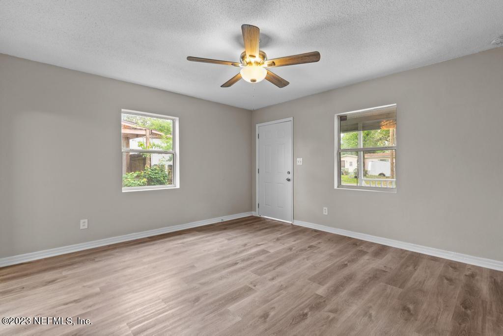 1023 Seba Street Jacksonville, FL 32205 - Photo 10 of 27 a view of an empty room with window and wooden floor