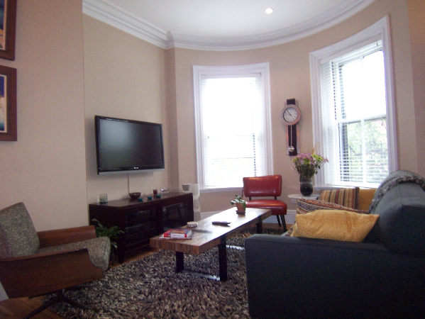 a living room with furniture and a flat screen tv