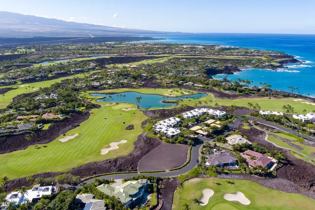 an aerial view of a residential houses and outdoor space