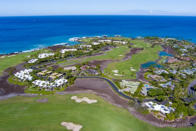 a view of a city with an ocean