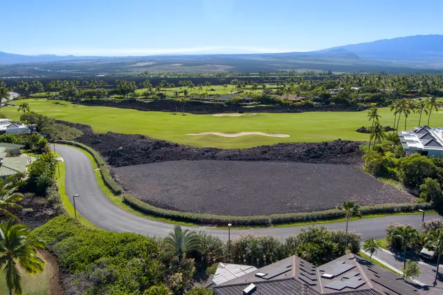 an aerial view of a house with outdoor space