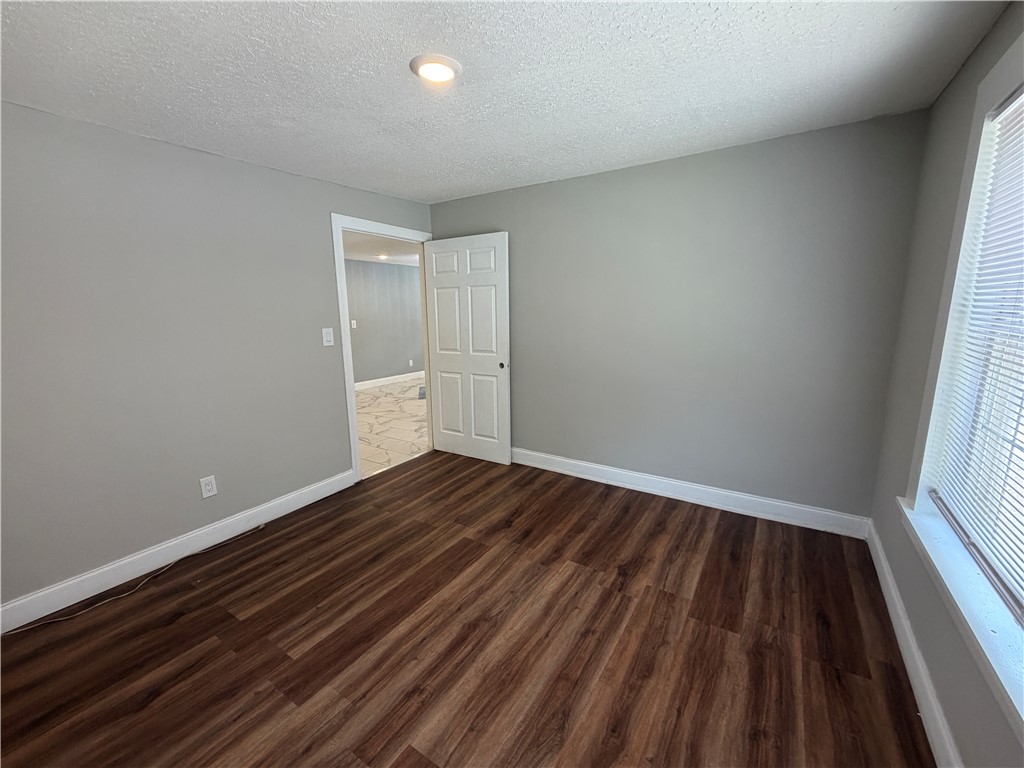 302 Sirrine Street Honea Path, SC 29654 - Photo 11 of 24 Rich wood flooring defines this inviting room, ready for your personal touch.