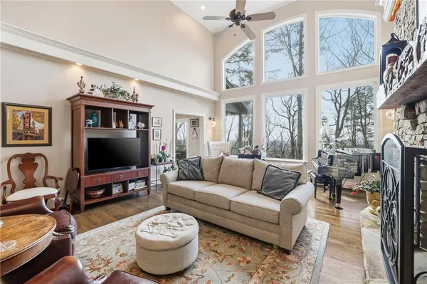 a living room with furniture a rug and a flat screen tv