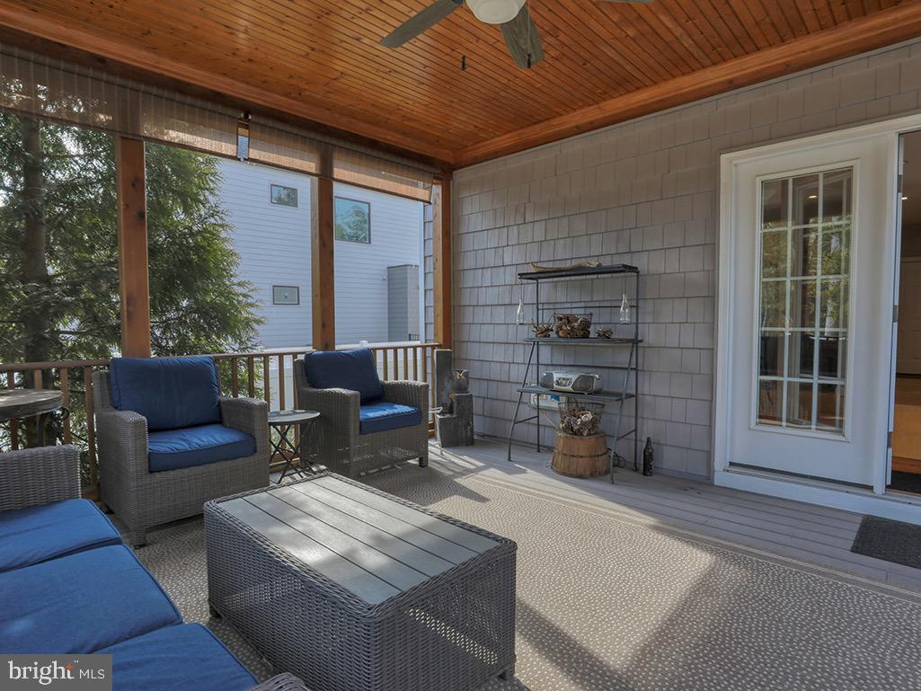 135 Cornwall Road Rehoboth Beach, DE 19971 - Photo 12 of 101 Screened porch ideal for hosting or relaxing.