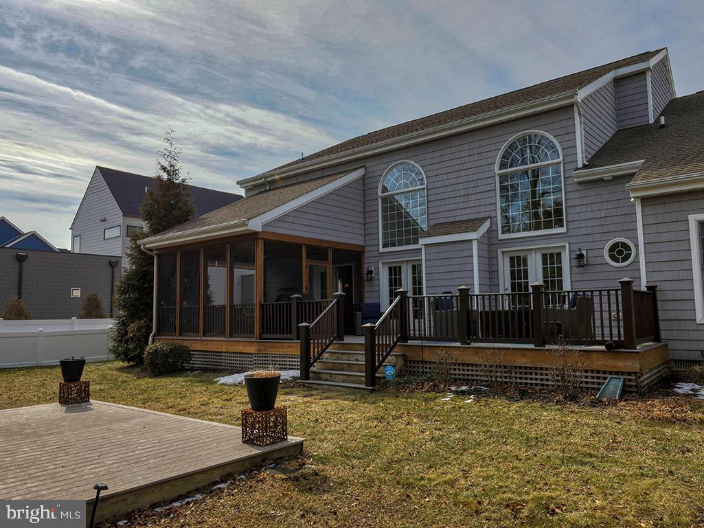 135 Cornwall Road Rehoboth Beach, DE 19971 - Photo 22 of 101 a front view of a house with garage