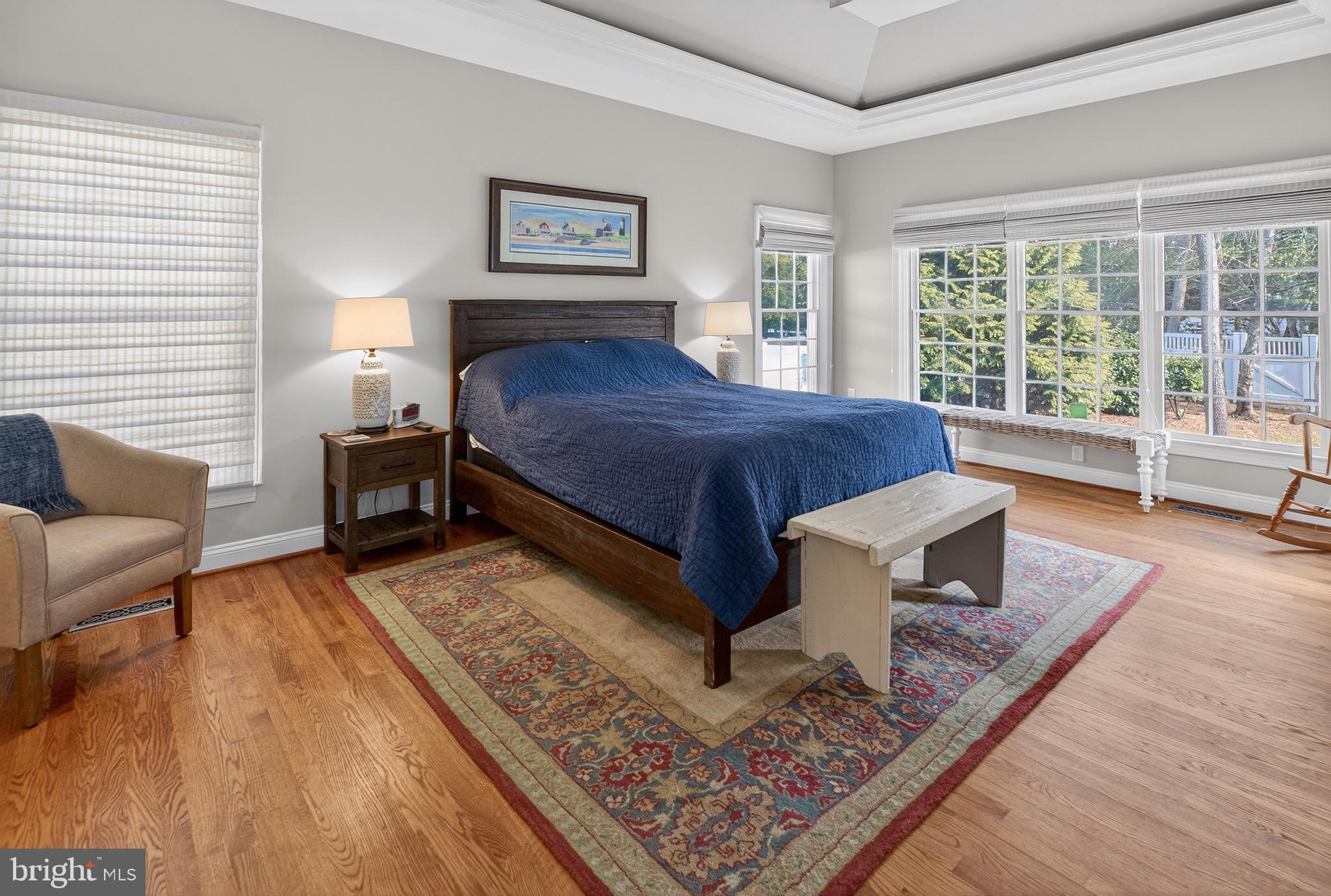 135 Cornwall Road Rehoboth Beach, DE 19971 - Photo 34 of 101 a spacious bedroom with a bed a couch and large window