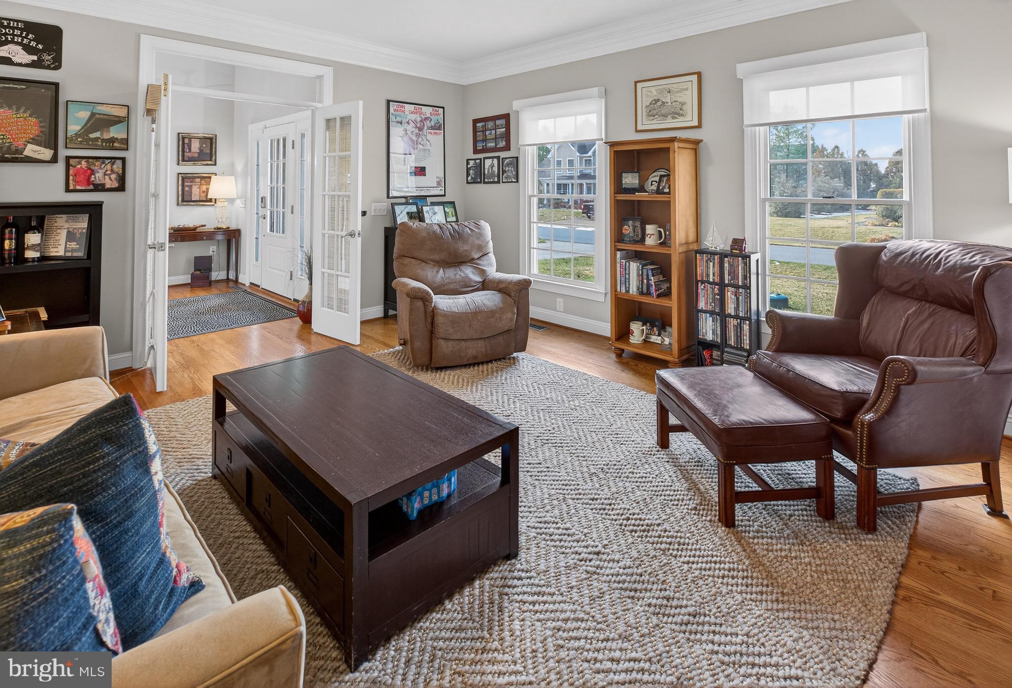 135 Cornwall Road Rehoboth Beach, DE 19971 - Photo 46 of 101 a living room with furniture and a bookshelf