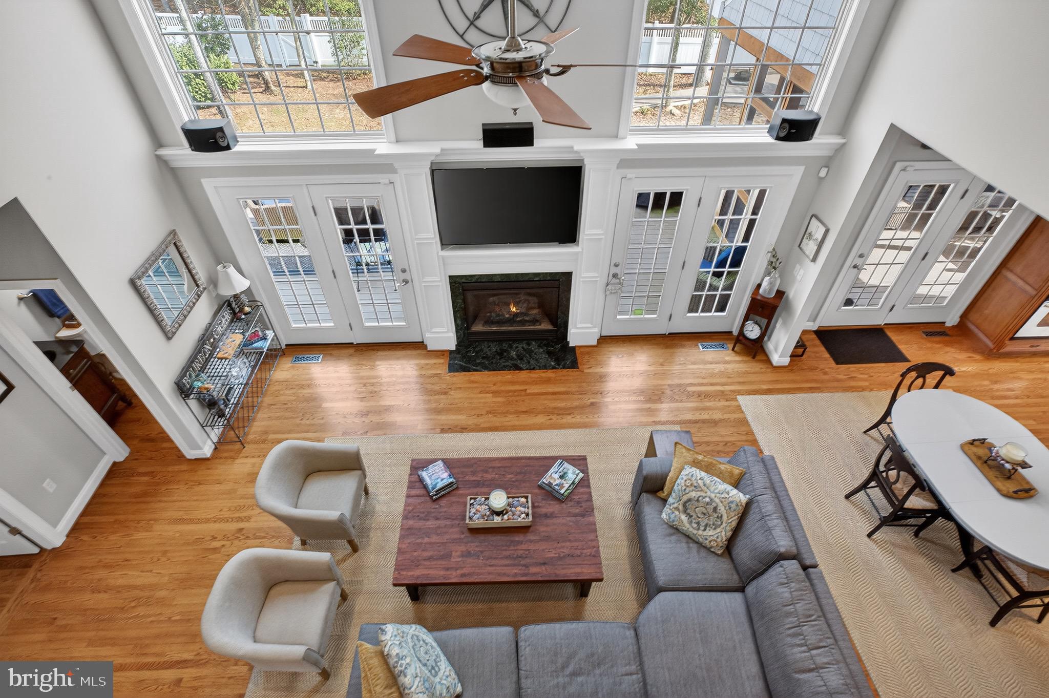 135 Cornwall Road Rehoboth Beach, DE 19971 - Photo 50 of 101 a living room with furniture and a fireplace