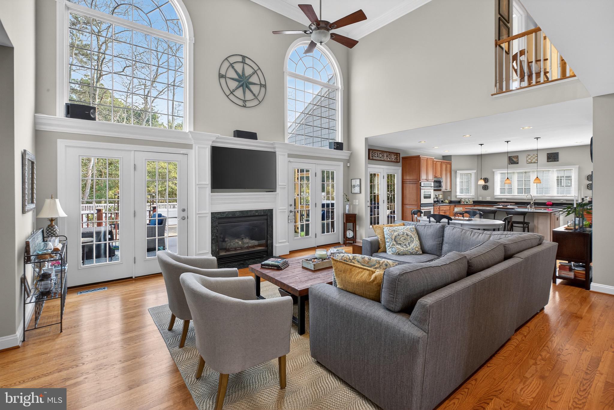 135 Cornwall Road Rehoboth Beach, DE 19971 - Photo 5 of 101 a living room with furniture kitchen view and a fireplace