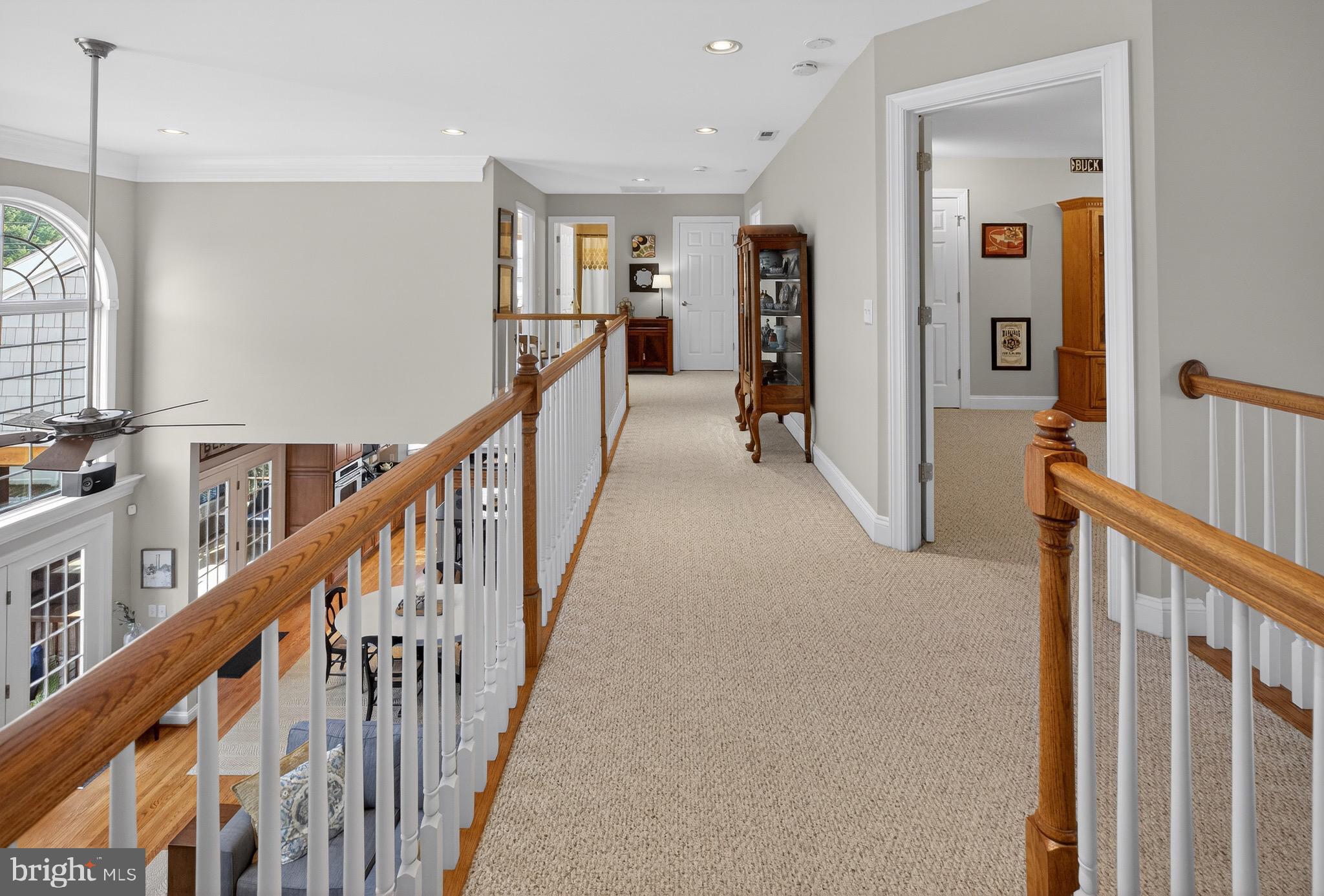 135 Cornwall Road Rehoboth Beach, DE 19971 - Photo 54 of 101 a view of a hallway with wooden floor and windows