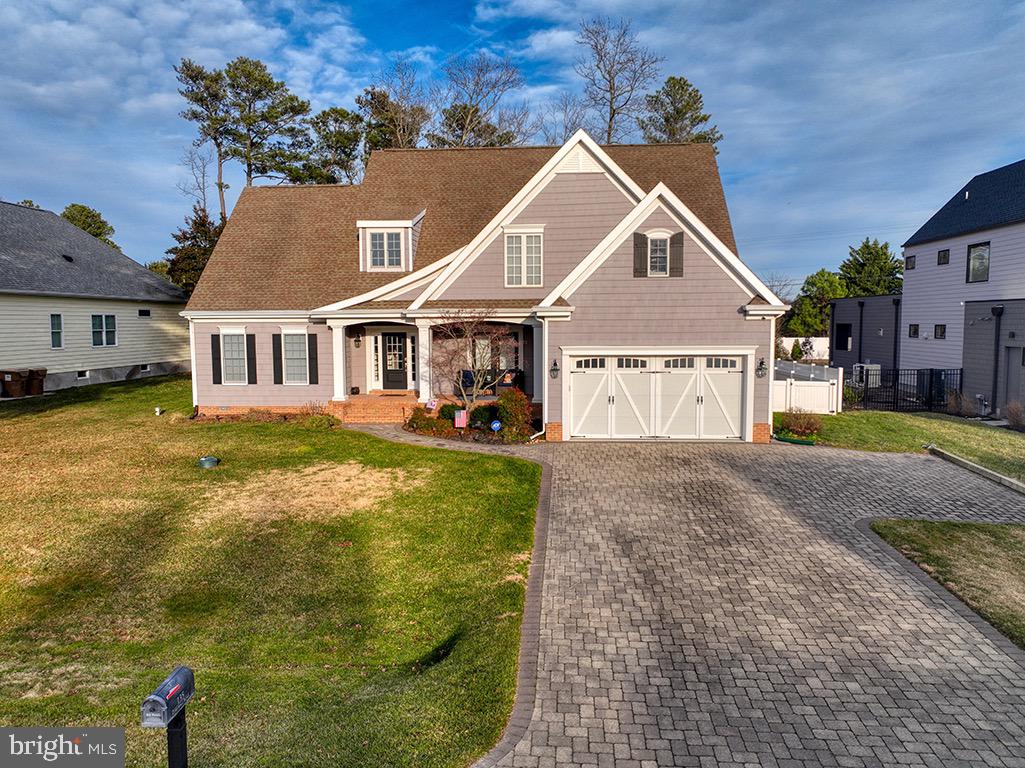 135 Cornwall Road Rehoboth Beach, DE 19971 - Photo 64 of 101 a front view of a house with a yard