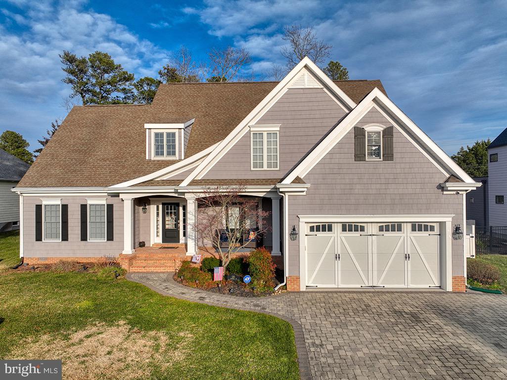 135 Cornwall Road Rehoboth Beach, DE 19971 - Photo 65 of 101 a view of a house with a yard patio and a garden