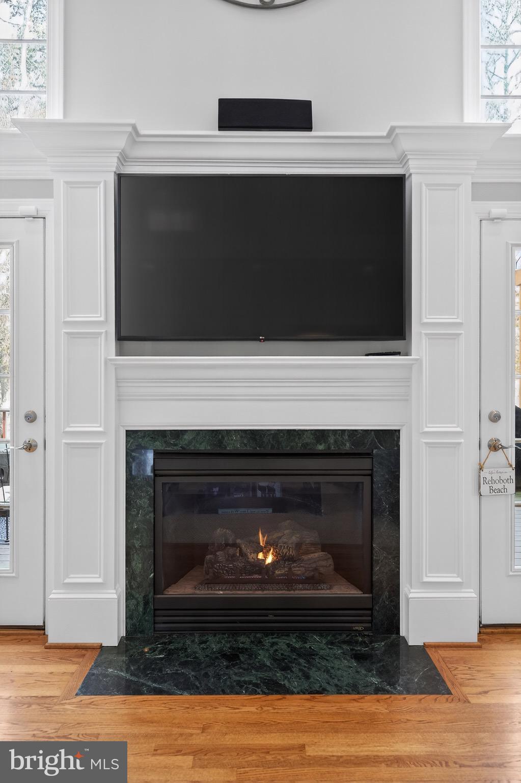 135 Cornwall Road Rehoboth Beach, DE 19971 - Photo 8 of 101 a living room with a fireplace