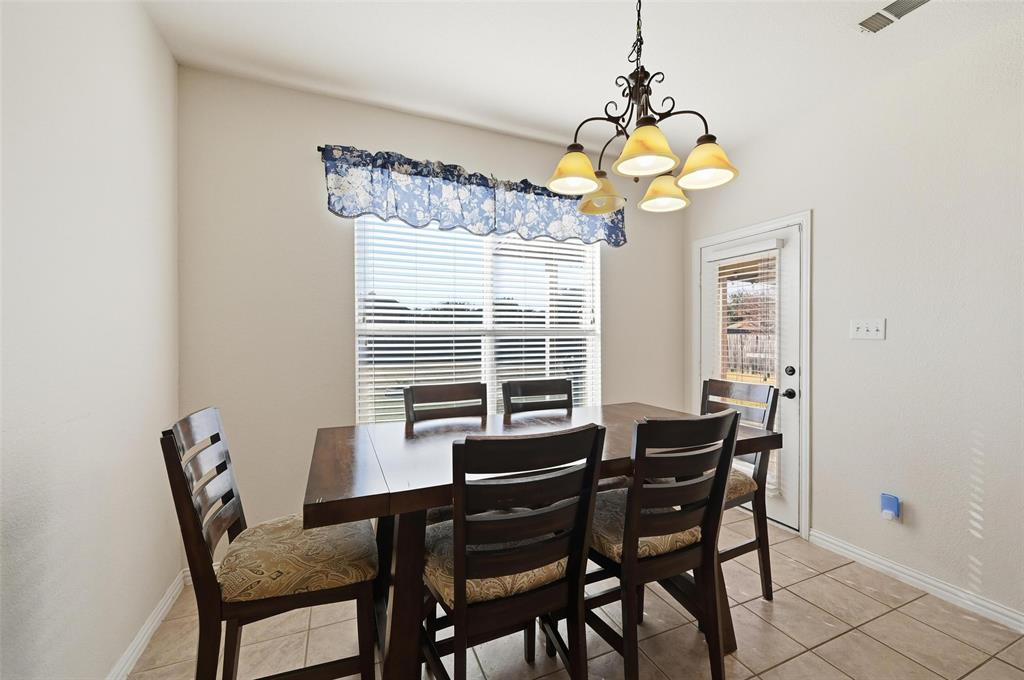 2319 Goshawk Street Grand Prairie, TX 75052 - Photo 14 of 40 a dining room with furniture and window
