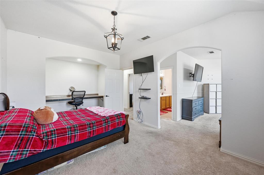 2319 Goshawk Street Grand Prairie, TX 75052 - Photo 31 of 40 a bedroom with bed and window