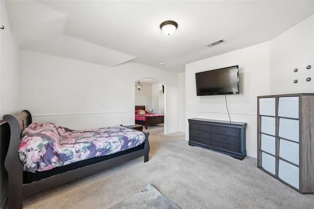 a bathroom with a sink a large mirror and a bathtub