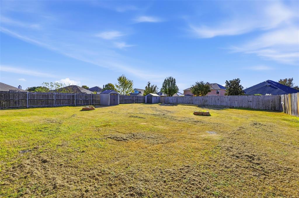 2319 Goshawk Street Grand Prairie, TX 75052 - Photo 36 of 40 a view of an swimming pool and a yard