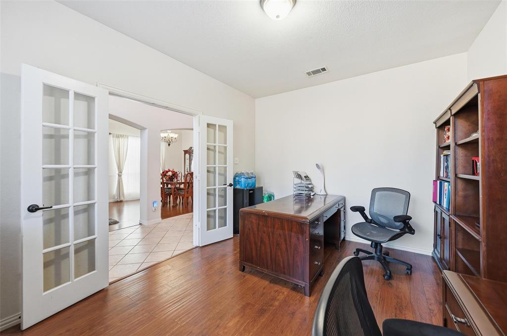 2319 Goshawk Street Grand Prairie, TX 75052 - Photo 5 of 40 a view of a workspace with furniture and lounge chair