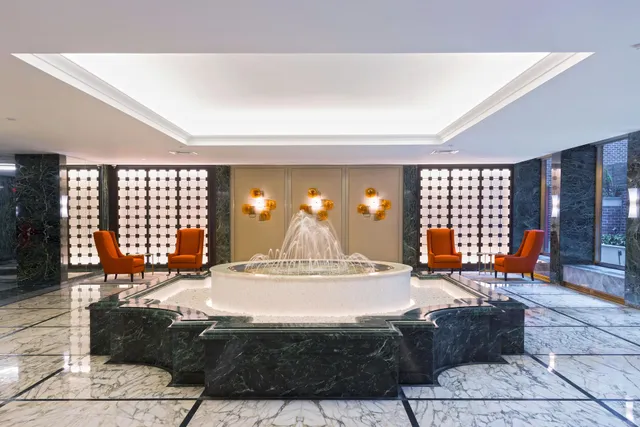 a living room with furniture a table and window