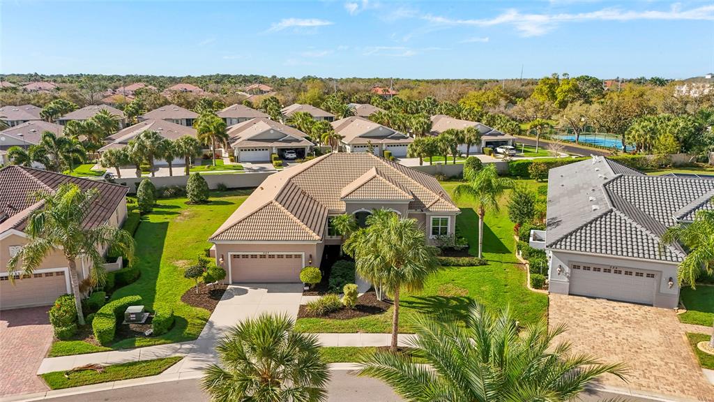 357 Marsh Creek Road Venice, FL 34292 - Photo 45 of 70 an aerial view of residential houses with outdoor space and trees