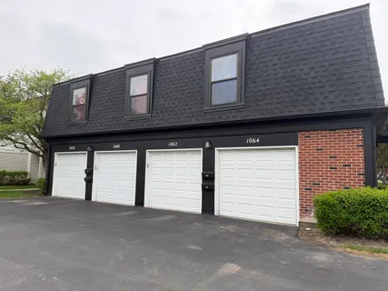a front view of a house with a garage