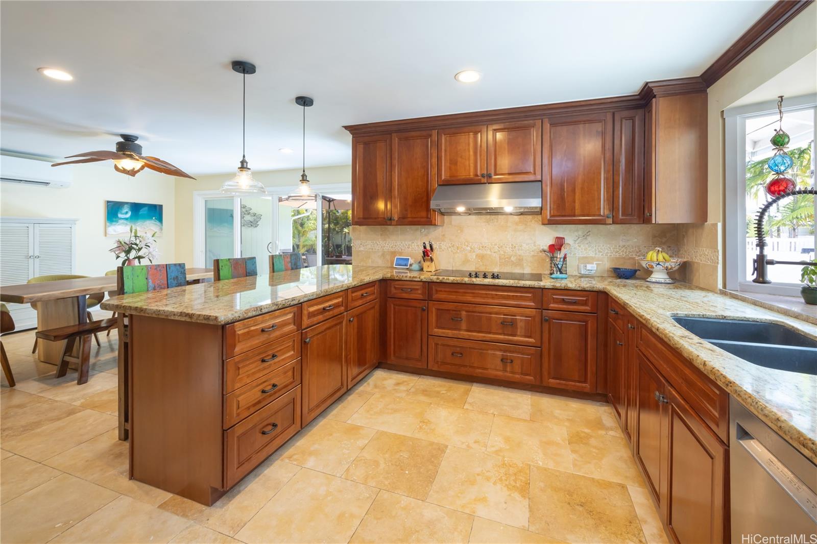 409 Wanaao Road Kailua, HI 96734 - Photo 3 of 25 a kitchen with stainless steel appliances granite countertop a sink a stove and a refrigerator