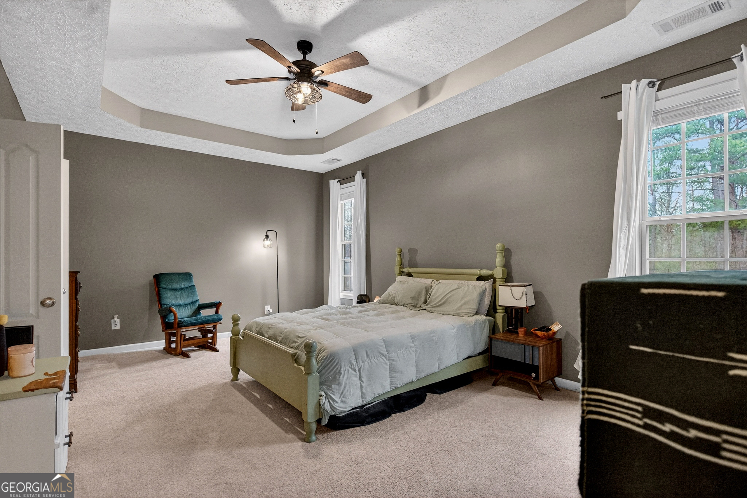 107 Amhurst Drive West Point, GA 31833 - Photo 15 of 29 a bedroom with a bed and a chandelier