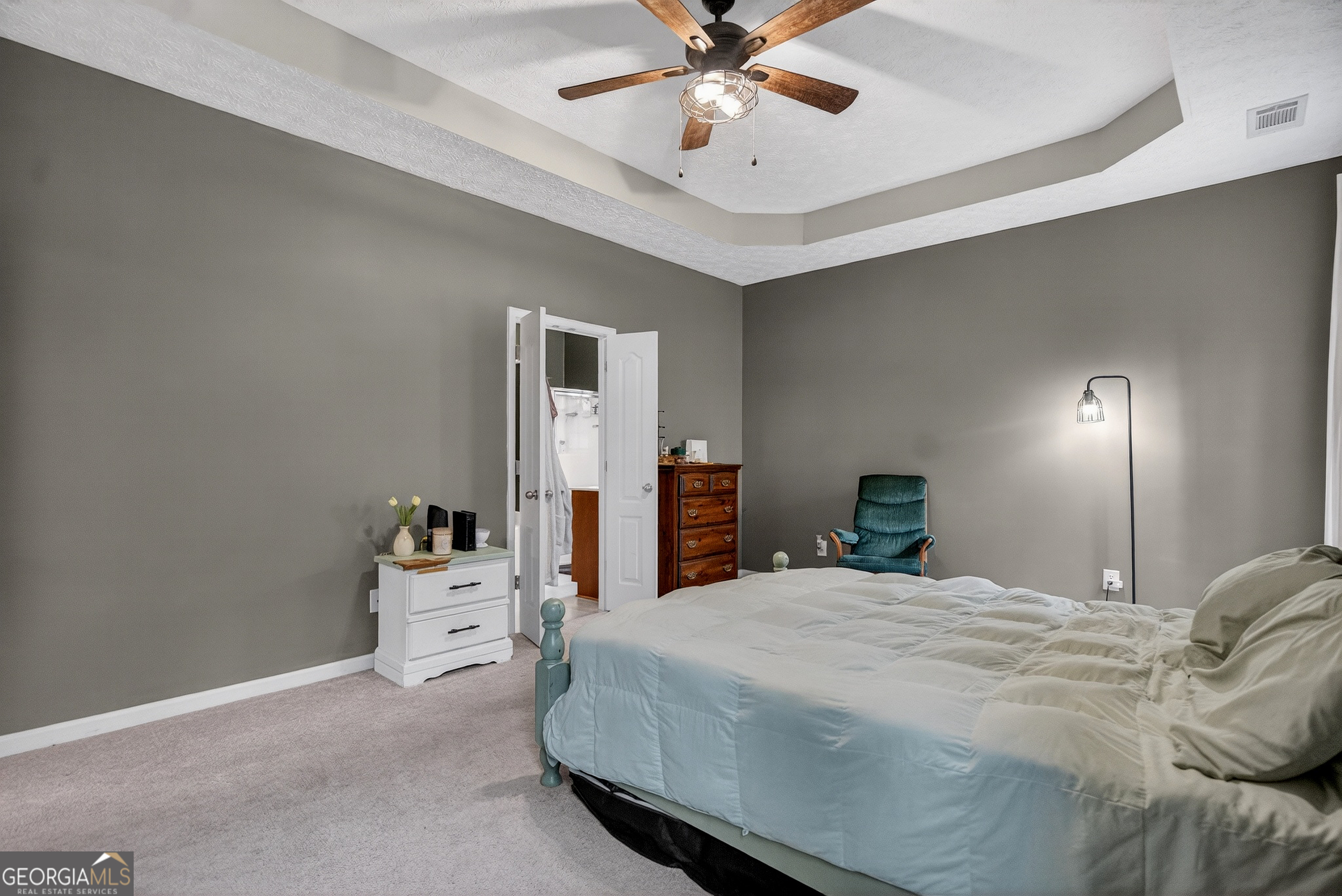 107 Amhurst Drive West Point, GA 31833 - Photo 16 of 29 a bedroom with a bed and a chandelier