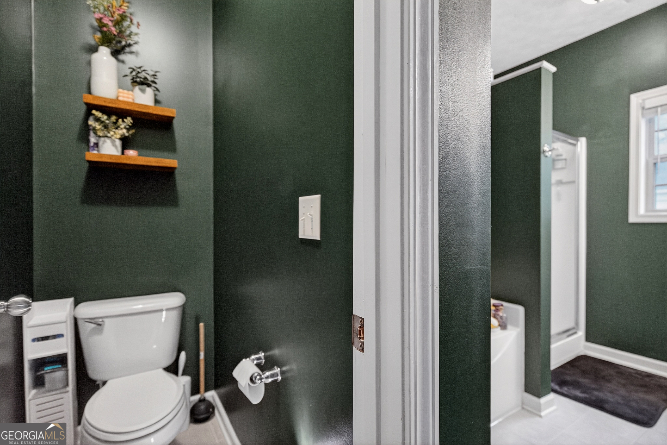 107 Amhurst Drive West Point, GA 31833 - Photo 19 of 29 a white toilet sitting next to a bathroom sink