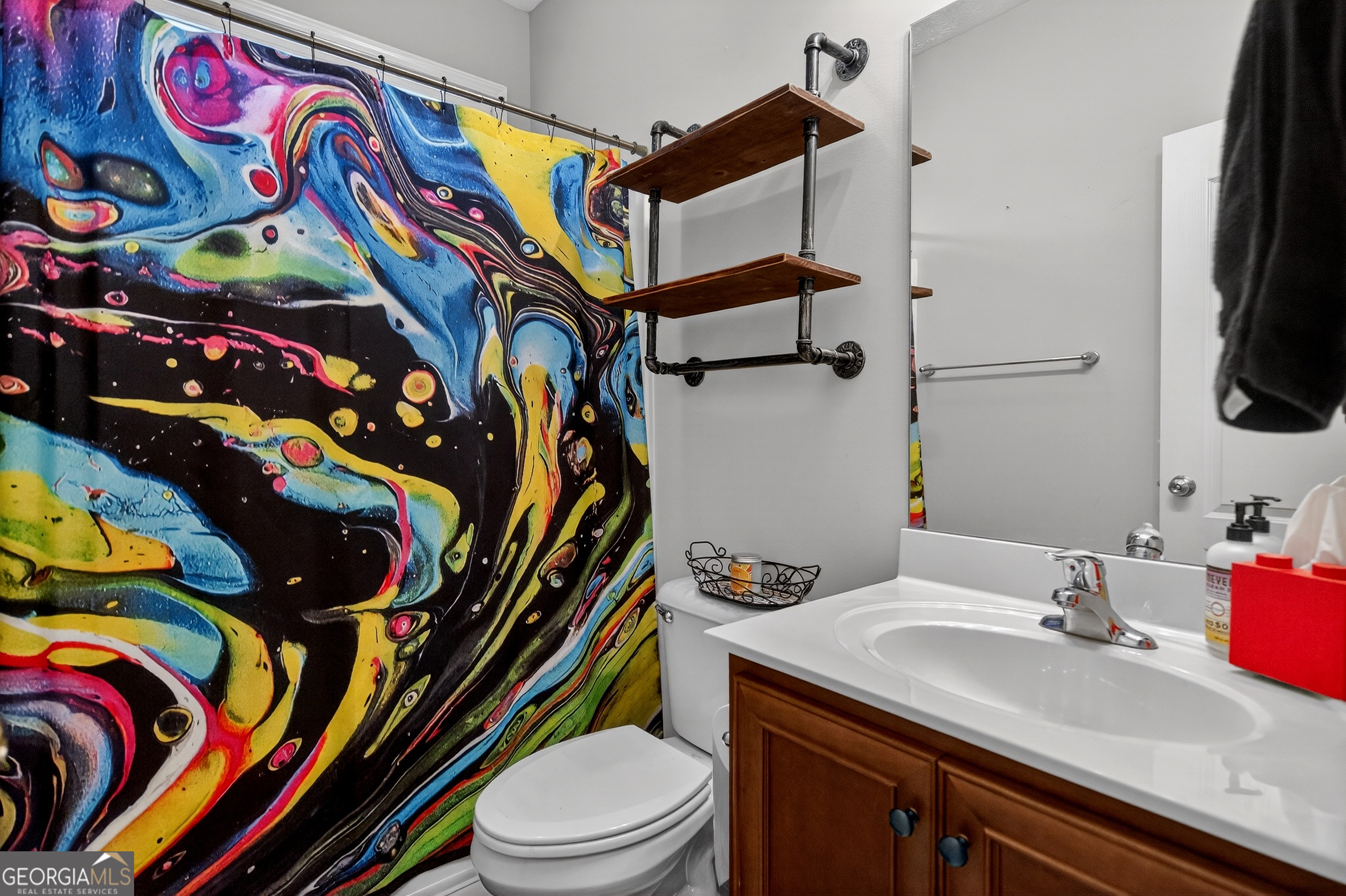 107 Amhurst Drive West Point, GA 31833 - Photo 21 of 29 a bathroom with a sink a toilet and mirror