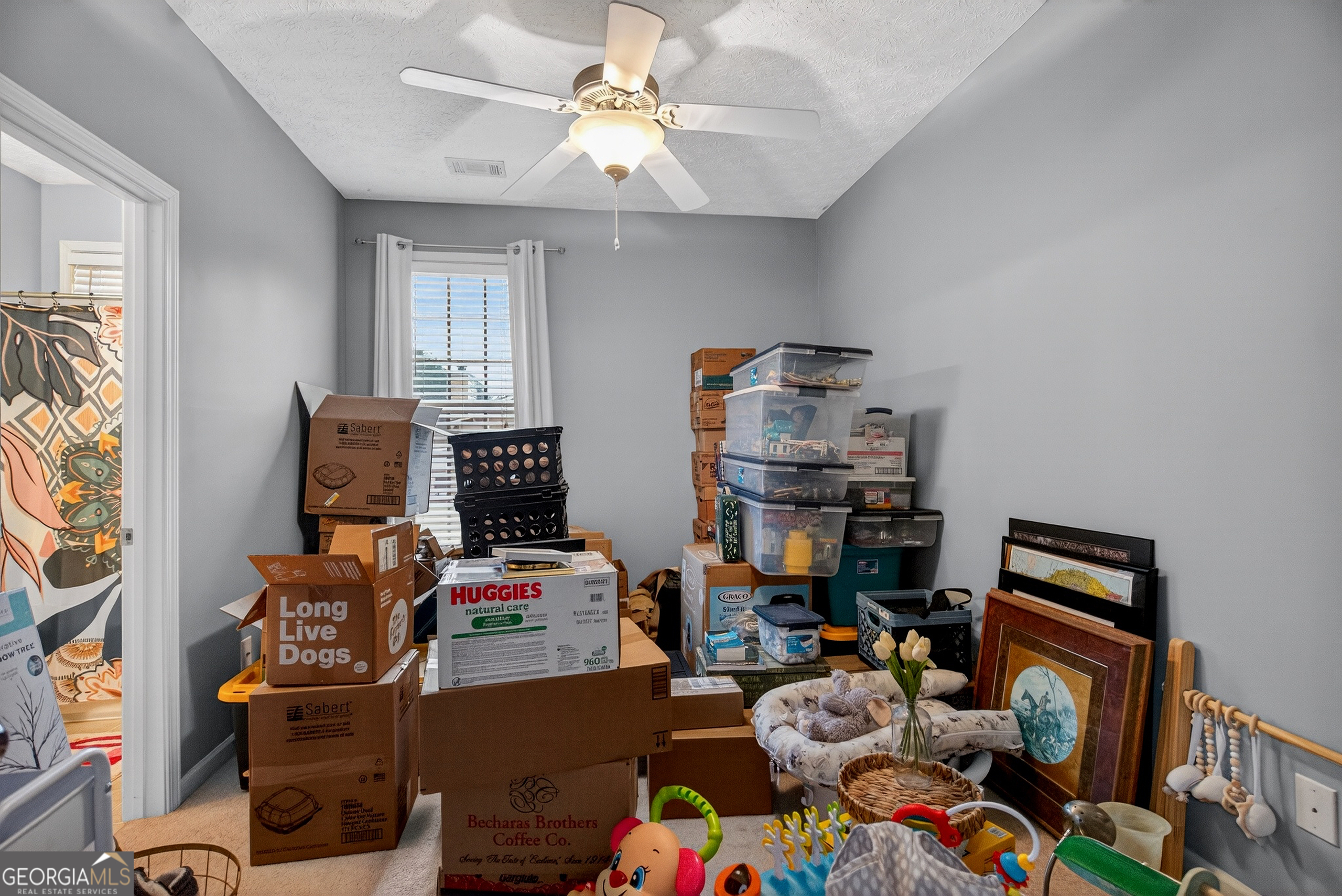 107 Amhurst Drive West Point, GA 31833 - Photo 23 of 29 a room with furniture a flat screen tv and a window