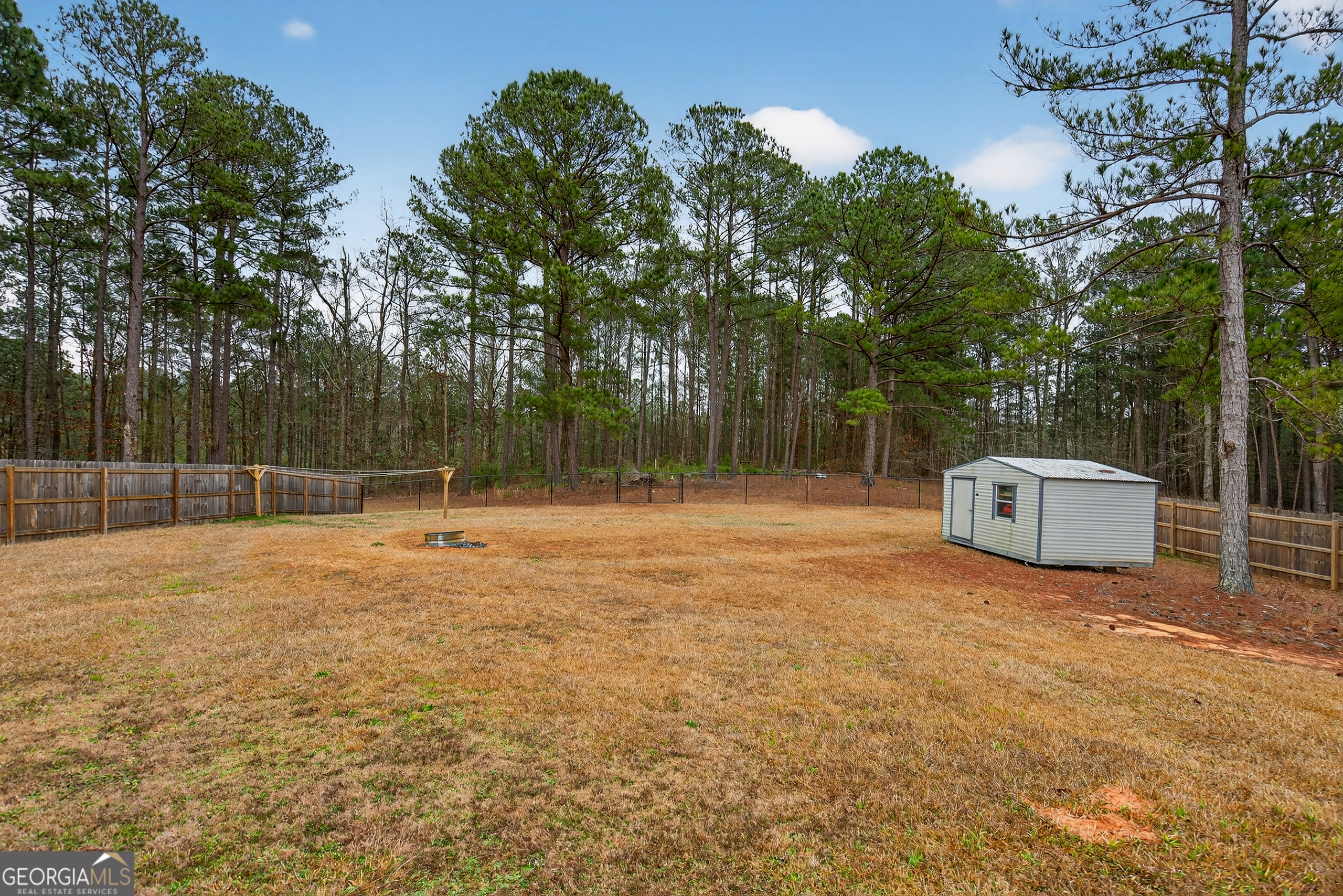 107 Amhurst Drive West Point, GA 31833 - Photo 27 of 29 a backyard of a house with trampoline