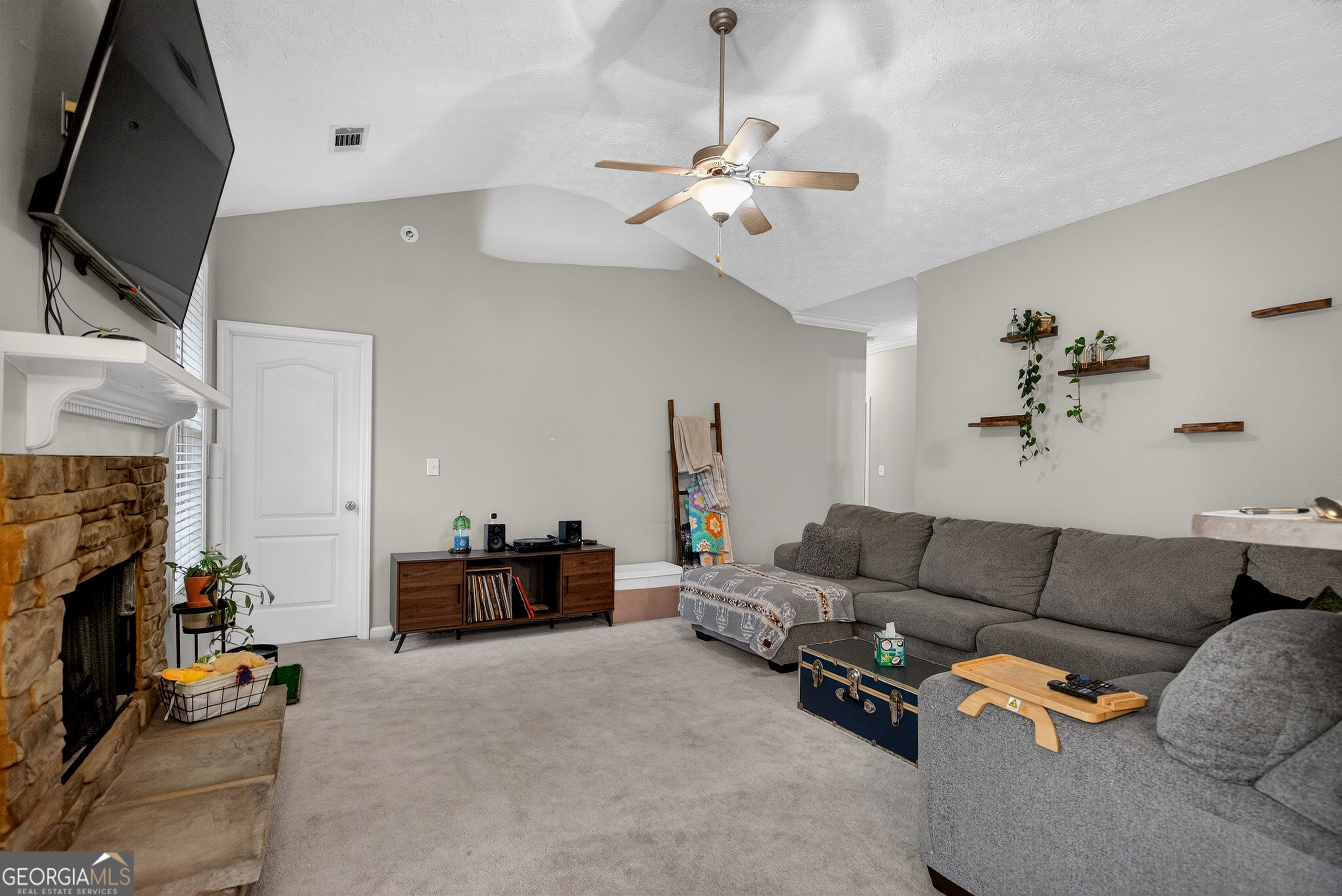 107 Amhurst Drive West Point, GA 31833 - Photo 7 of 29 a living room with furniture and a fireplace