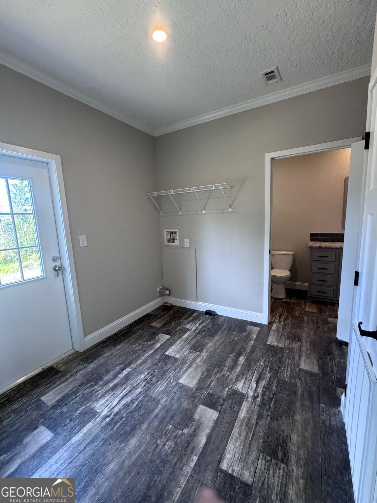 44 Long Leaf Road Hazlehurst, GA 31539 - Photo 11 of 21 a view of a room with wooden floor