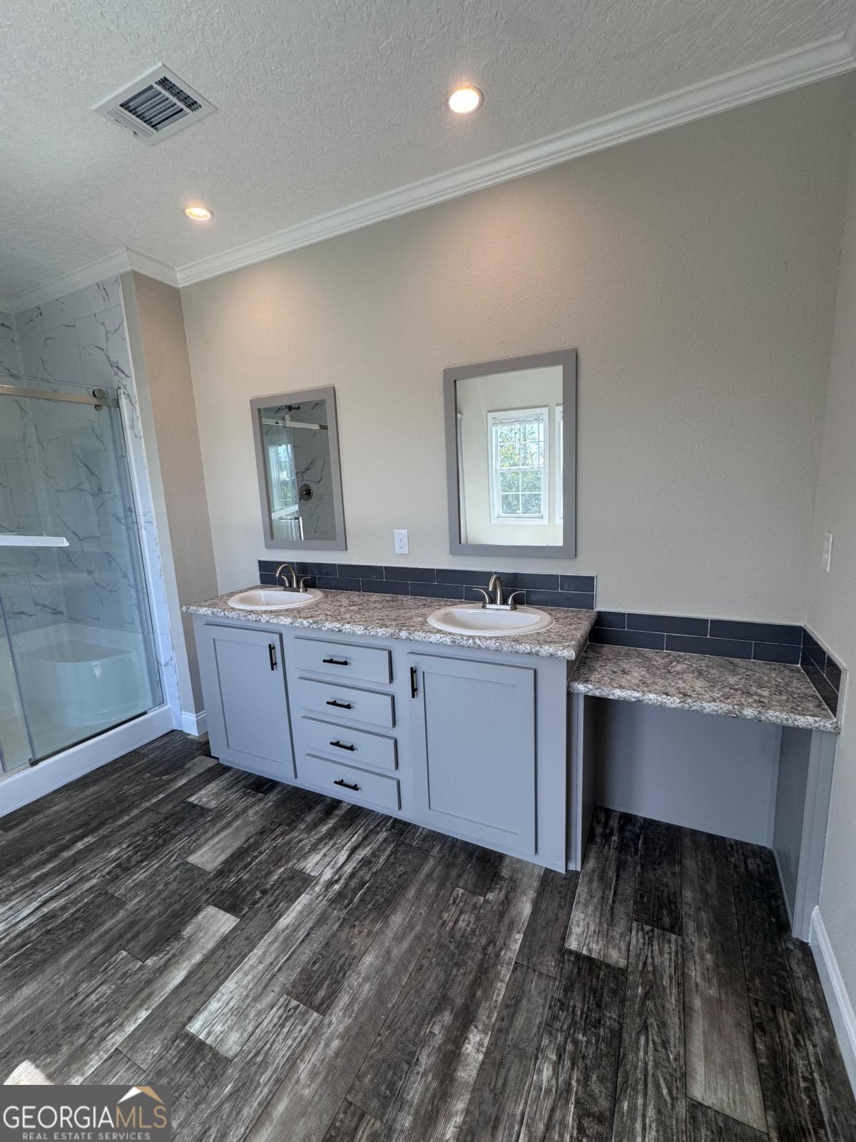 44 Long Leaf Road Hazlehurst, GA 31539 - Photo 21 of 21 a room with a sink and a mirror